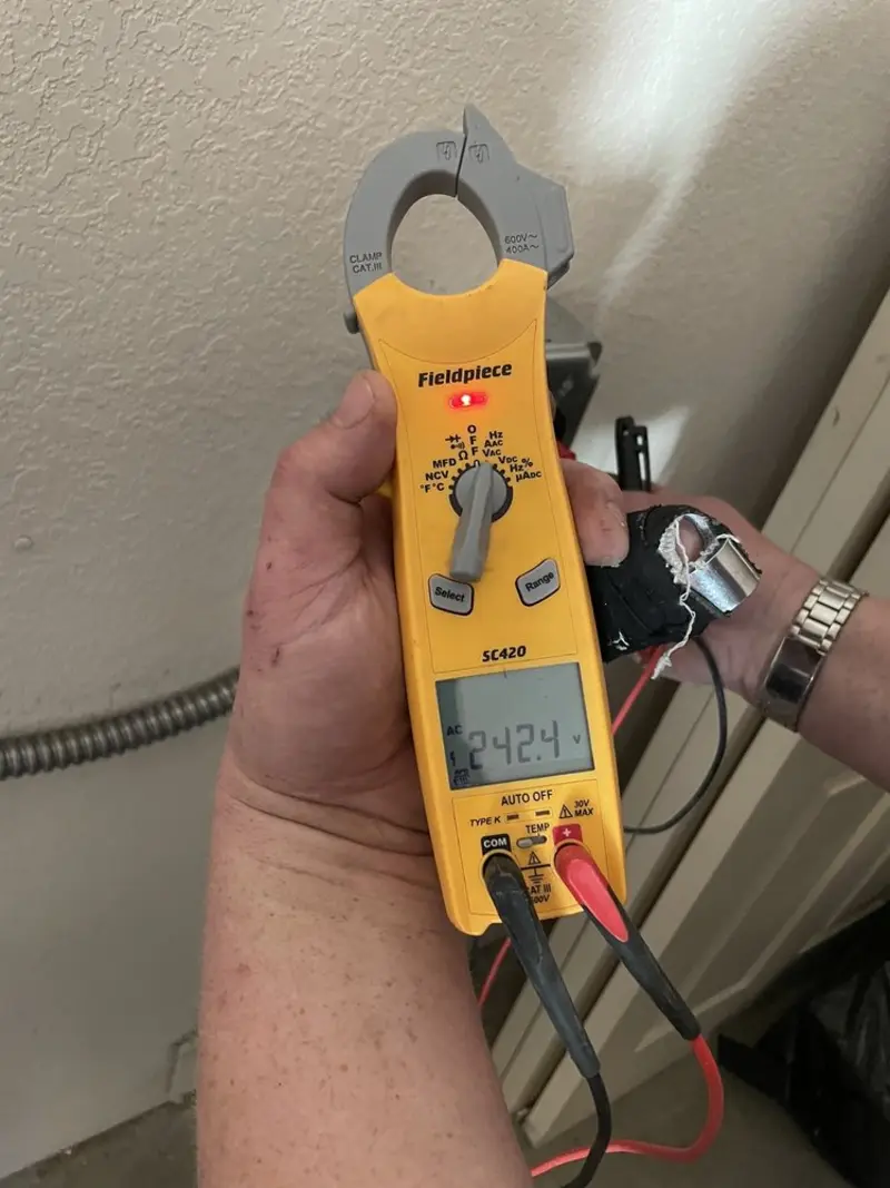 Voltage testing with clamp meter during Outlet Installation in Clarkston